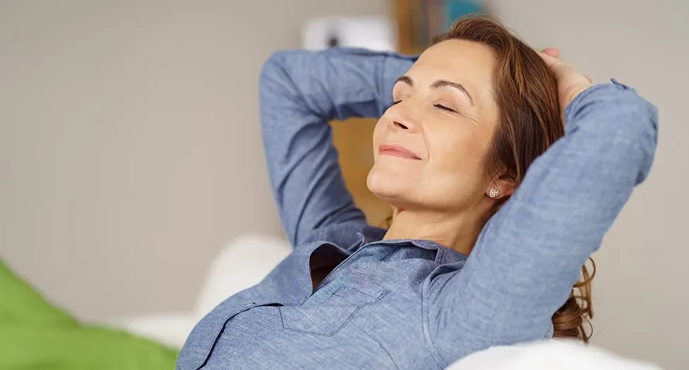 Relaxed woman with heand behind her head