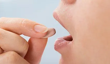 Patient taking oral sedative pill
