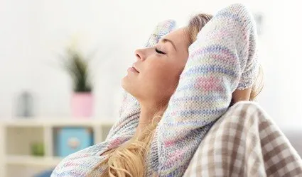 Relaxing woman with hands behind head