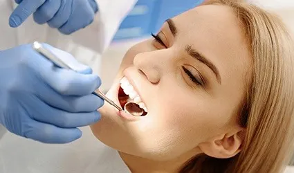 Woman receiving dental exam