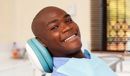 Smiling man in dental chair
