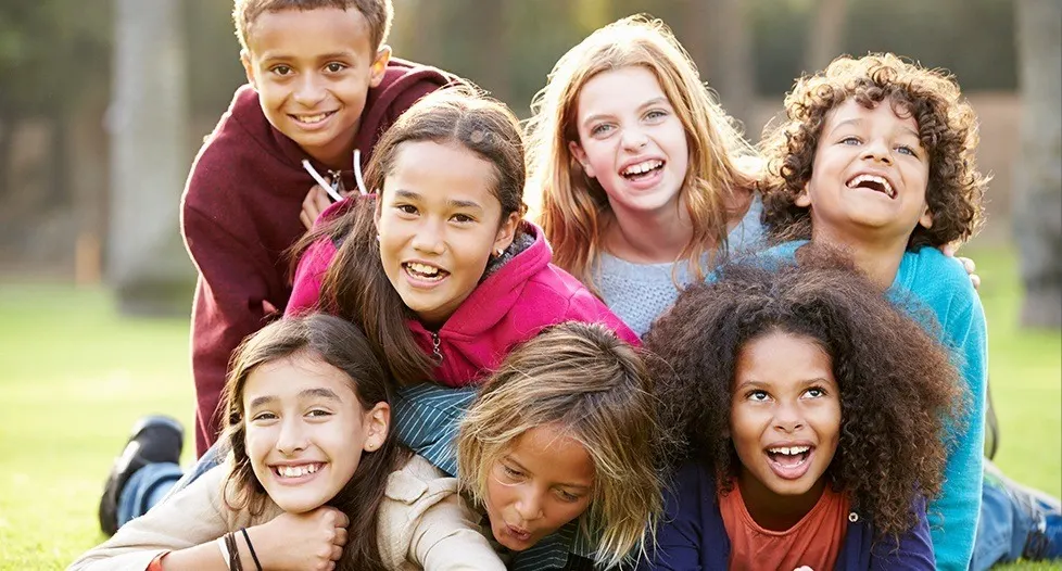 Group of laughing kids outdoors