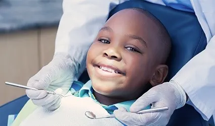 Smiling child in dental chair