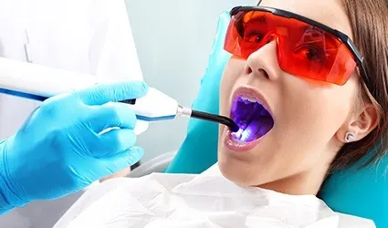 Child receiving dental sealants