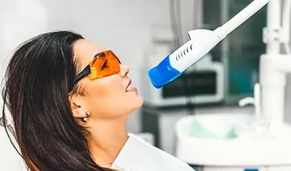 Woman receiving teeth whitening