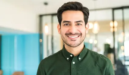person smiling in an office