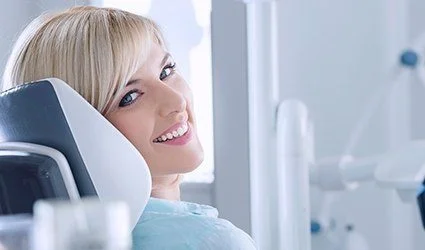 Smiling woman in dental chair
