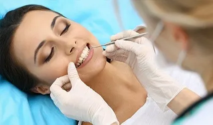 Woman receiving dental exam