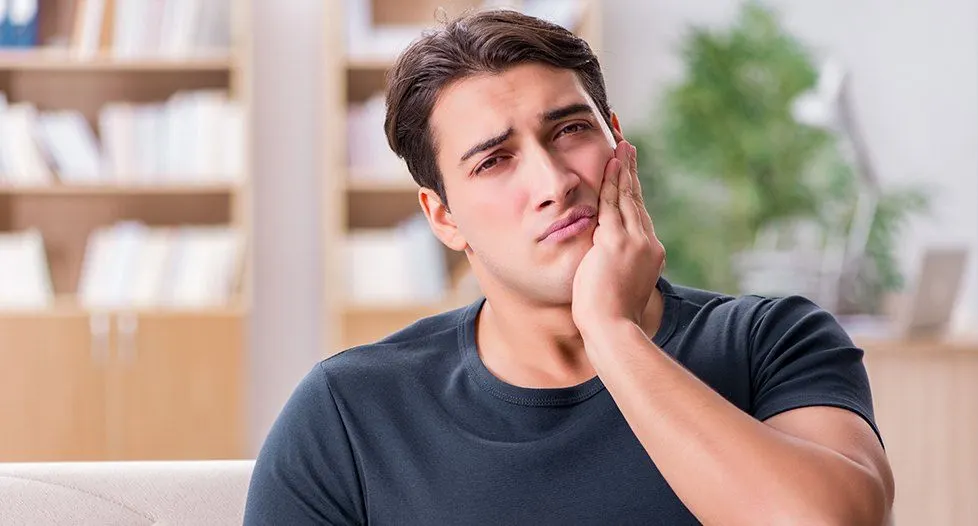 Man holding jaw