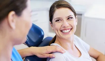 Smiling woman in dental chair