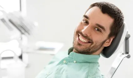 Male patient after dental implant salvage treatment