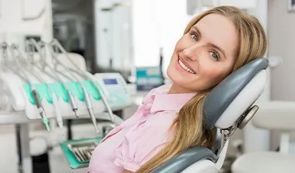 Smiling woman in dental chair
