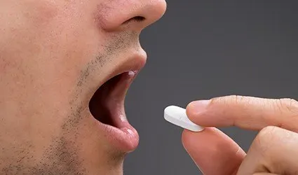 Patient taking oral sedative pill