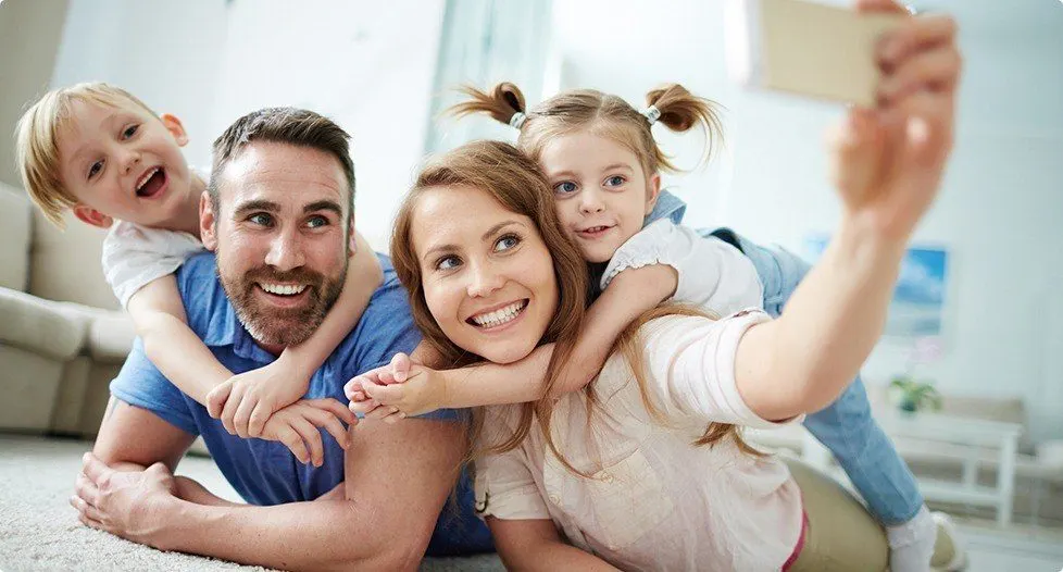 Smiling family of four