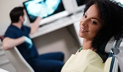 Smiling woman in dental chair