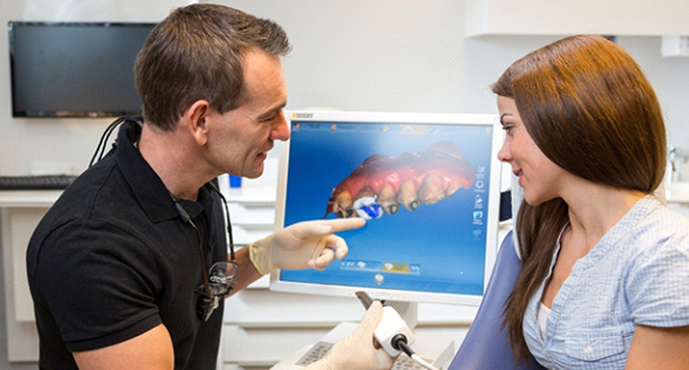 dentist in Park City taking impressions of a patient’s tooth