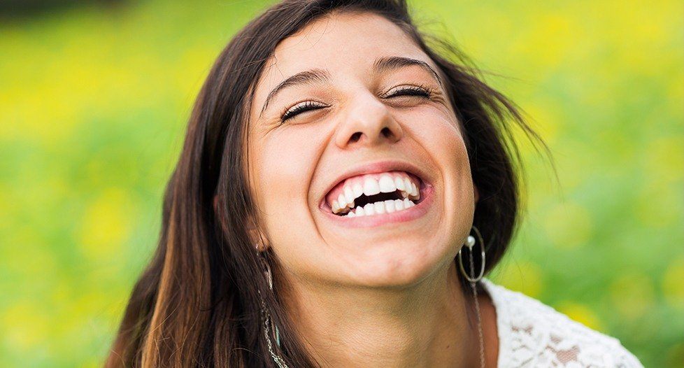 Laughing woman outdoors